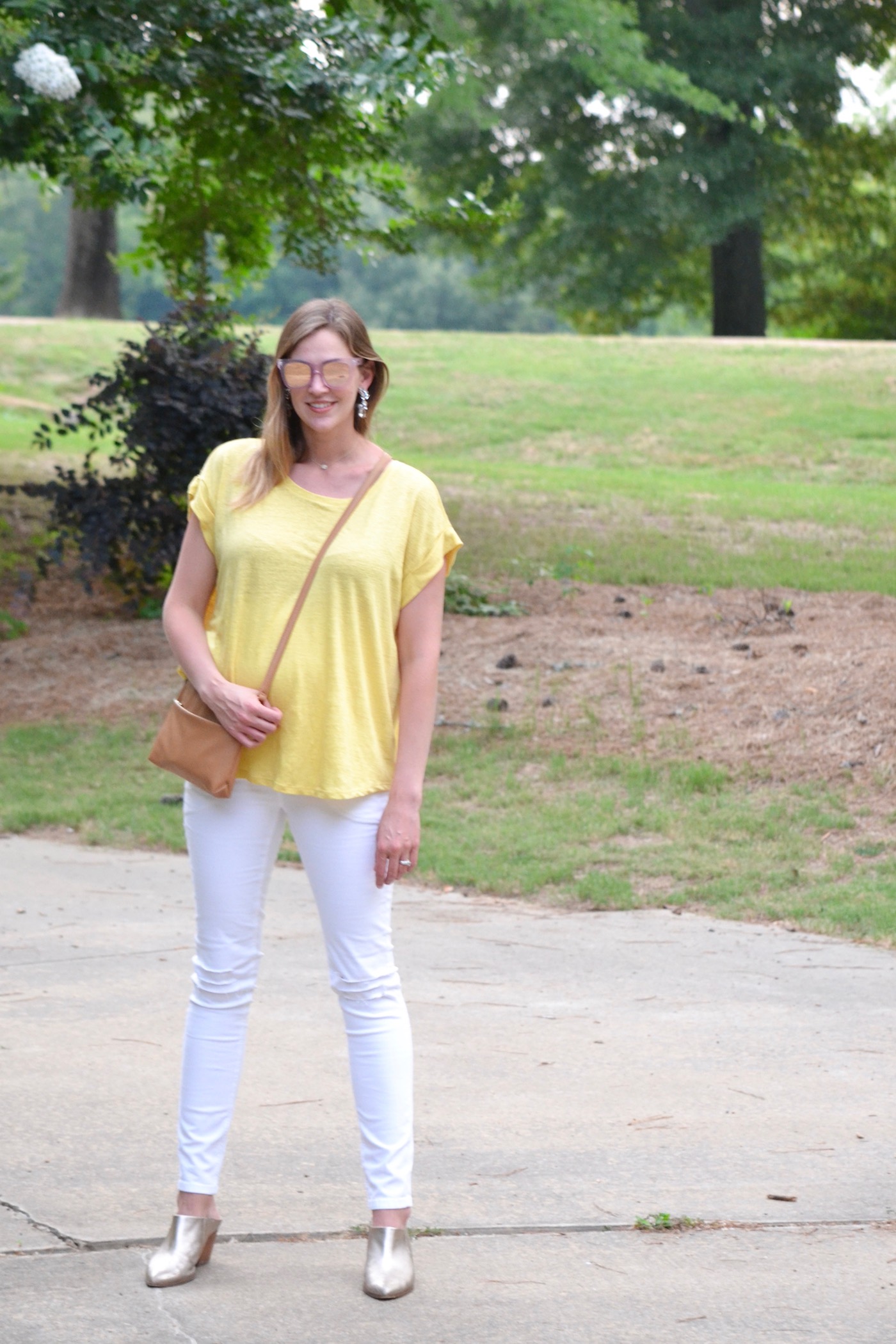 Canary Yellow from Hatch Collection and ripped white skinny jeans from Posh Bump // second trimester style // www.thehiveblog.com